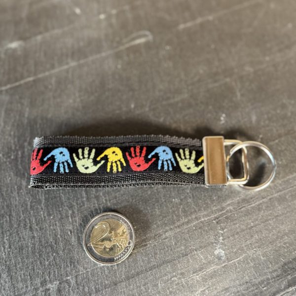 Schlüsselband "Bunte Hände", Gurtband schwarz